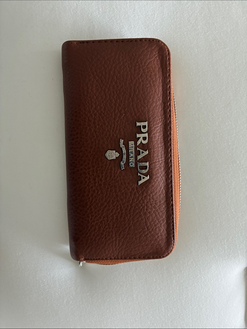 Prada Brown Pebbled Leather Zip-Around Wallet with Silver Logo